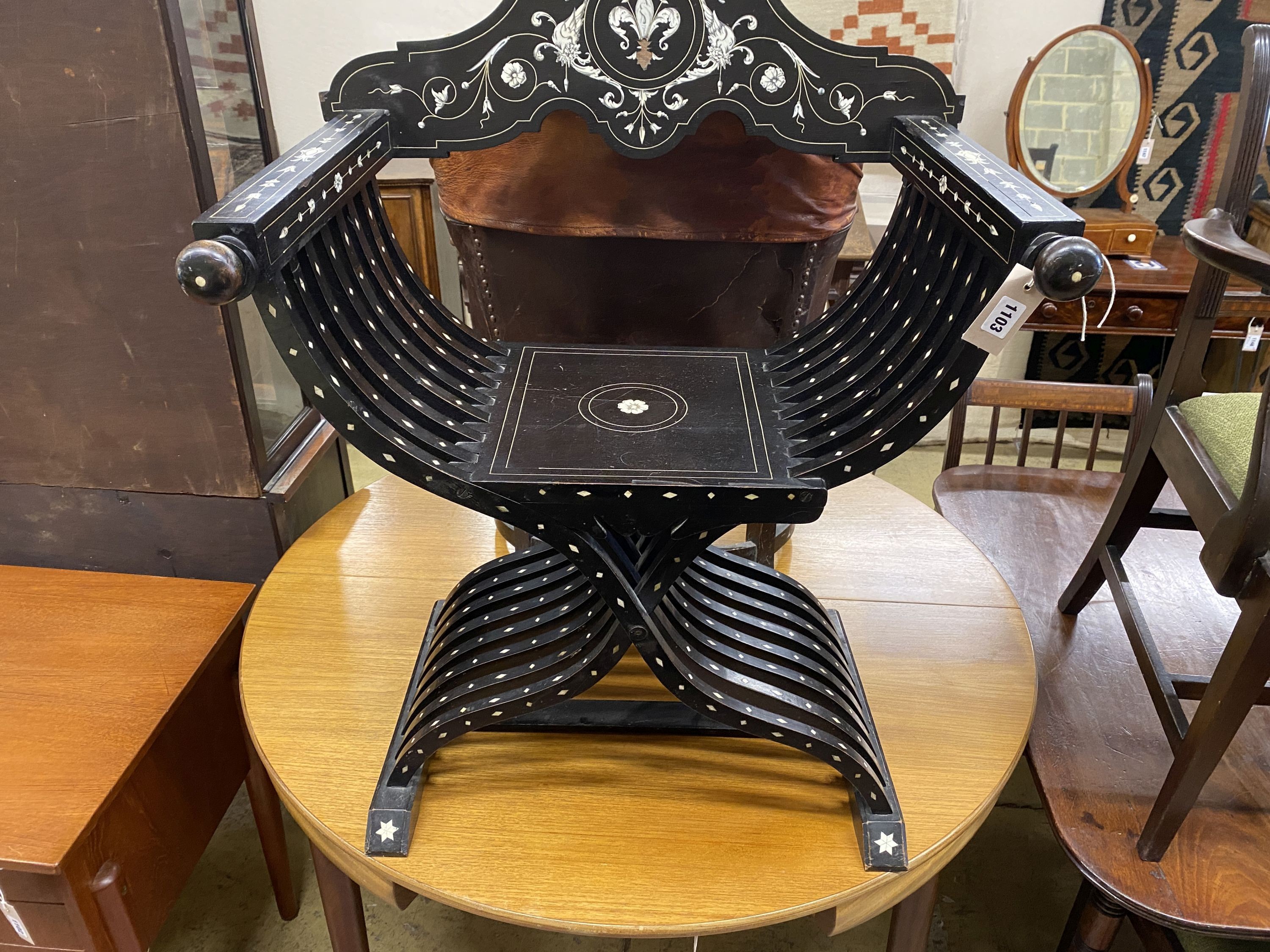 A 19th century Italian ebonised bone inlaid savonarola chair, width 72cm, depth 33cm, height 97cm